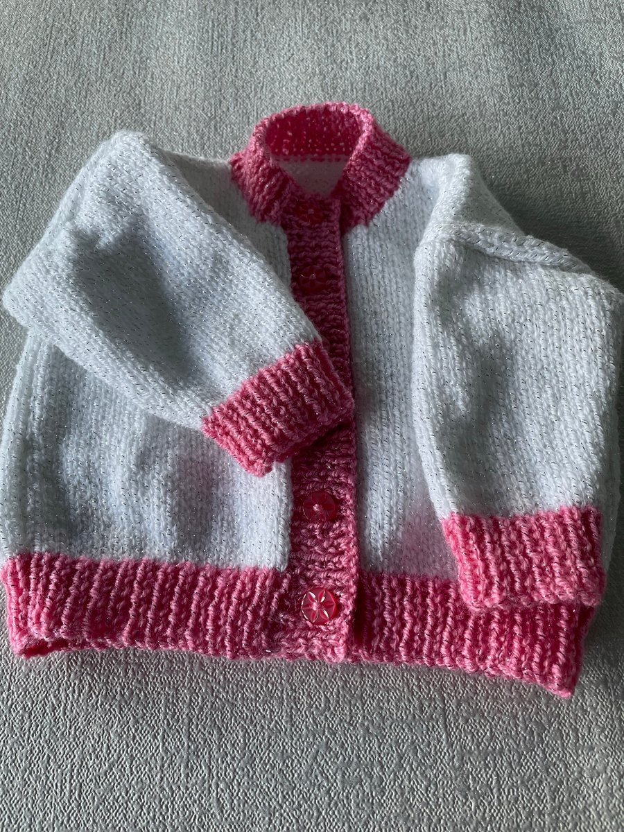 Sparkly white cardigan with pink bands