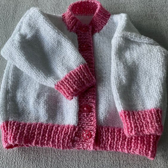 Sparkly white cardigan with pink bands