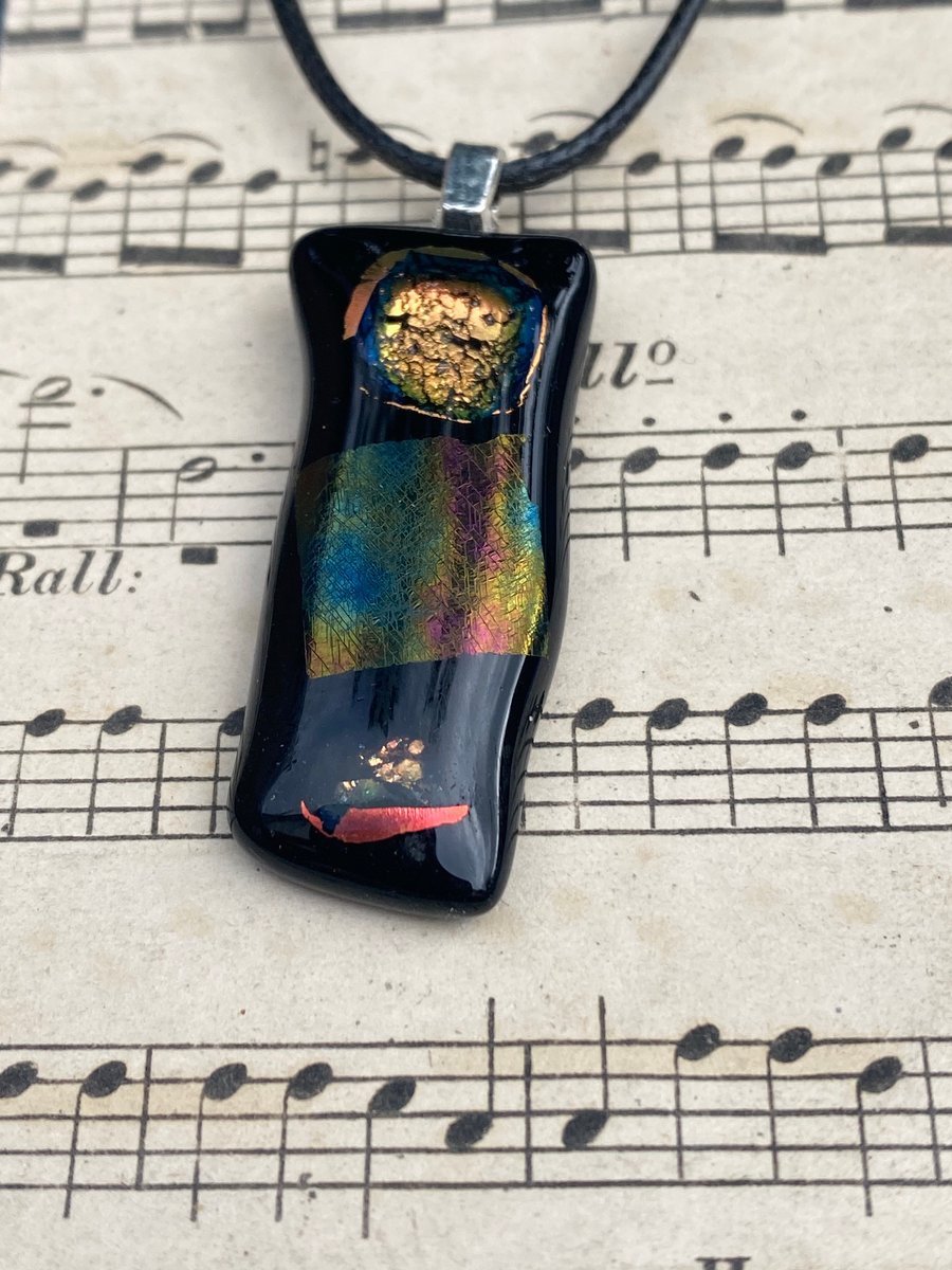 Black and iridescent flame fused glass pendant 