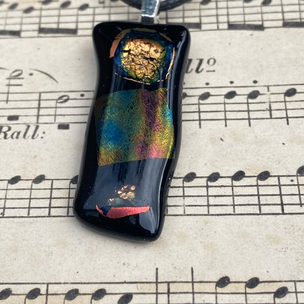 Black and iridescent flame fused glass pendant 