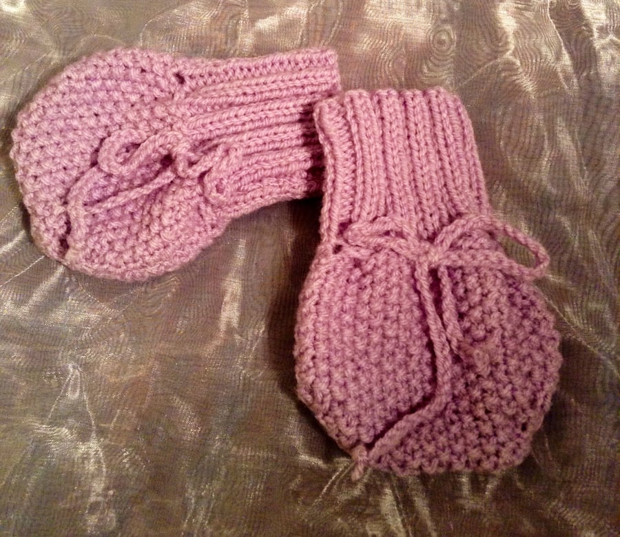 Little knitted purple baby mittens