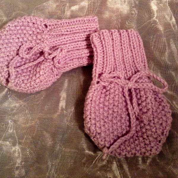 Little knitted purple baby mittens