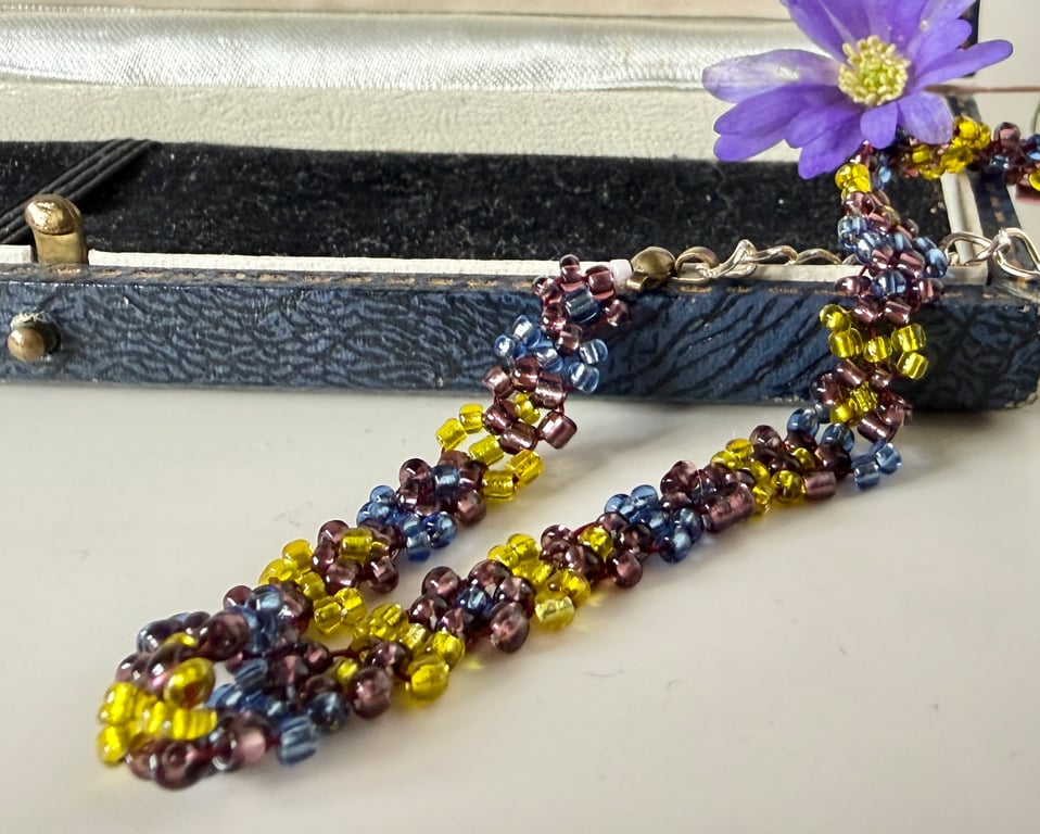 Colourful seed bead daisy chain bracelet with extender chain.