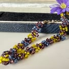 Colourful seed bead daisy chain bracelet with extender chain.