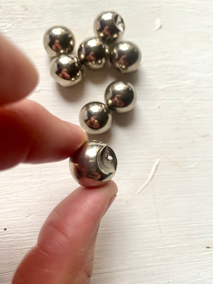 8 silver coloured sphere shaped vintage buttons with shank