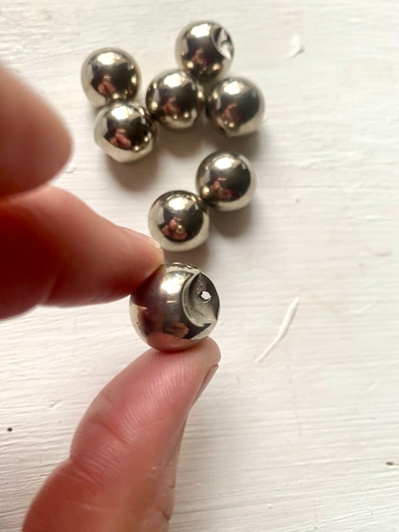 8 silver coloured sphere shaped vintage buttons with shank