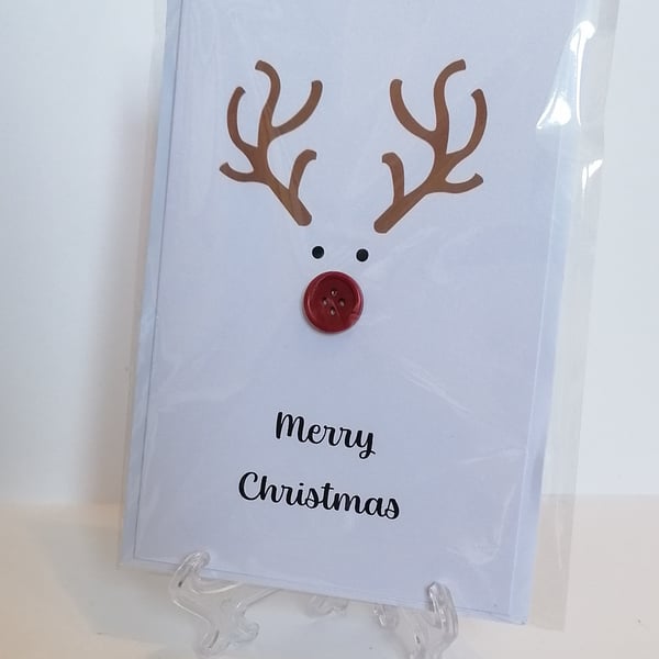 Merry Christmas card with a red nose button reindeer 