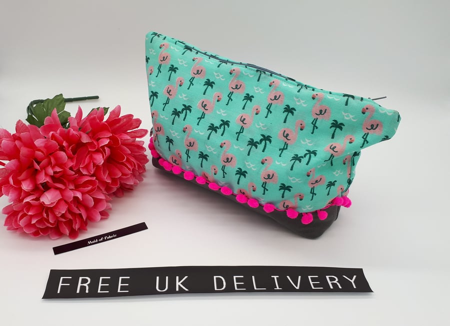 Storage bag,  case in flamingo fabric with pink bobble trim. 