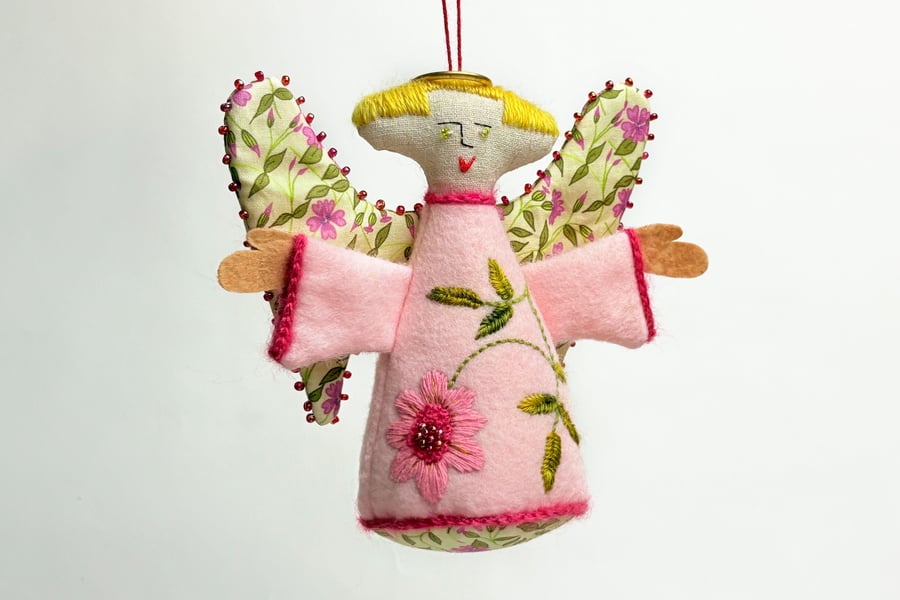 Pale pink hanging angel with hand embroidered marigold