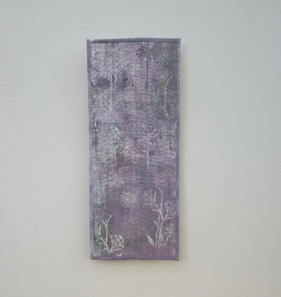 White flower fabric wall hanging.  A white and lilac garden impression
