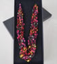 Crocheted necklace, lightweight, in shades of pink, purple, yellow and green - Image 1