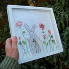 Hare in Meadow.  Hand stitched 