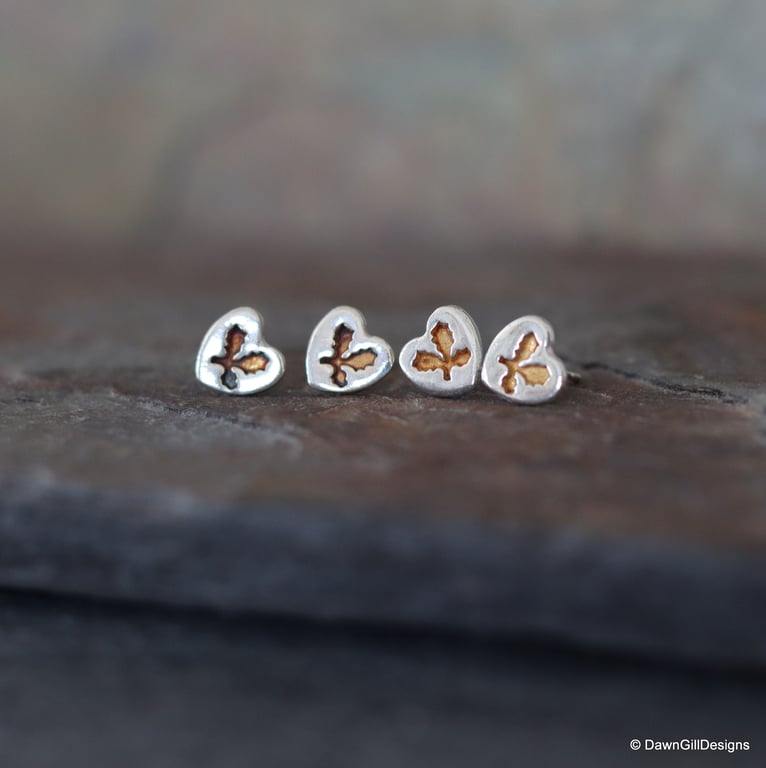 Delicate, textured, fine silver (999) heart and holly leaf stud earrings. Unique