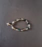 Elasticated bracelet with blue and clear beads and silver shell charm  - Image 2