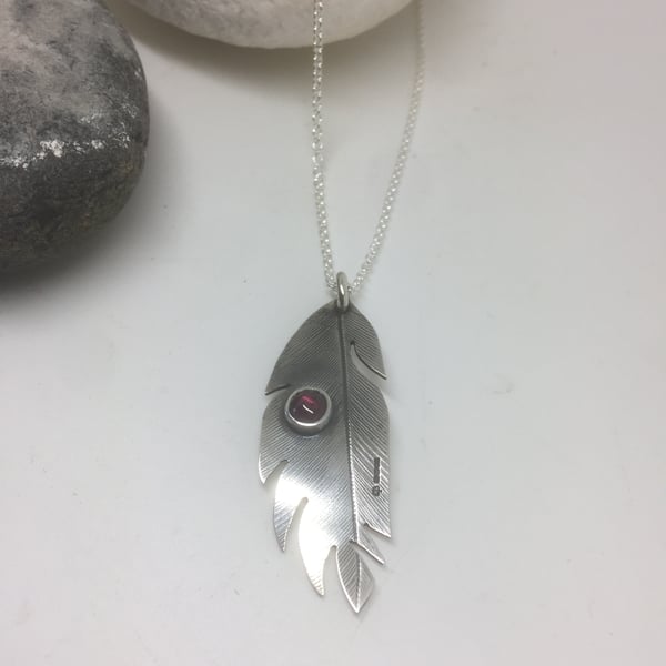 Feather pendant with garnet