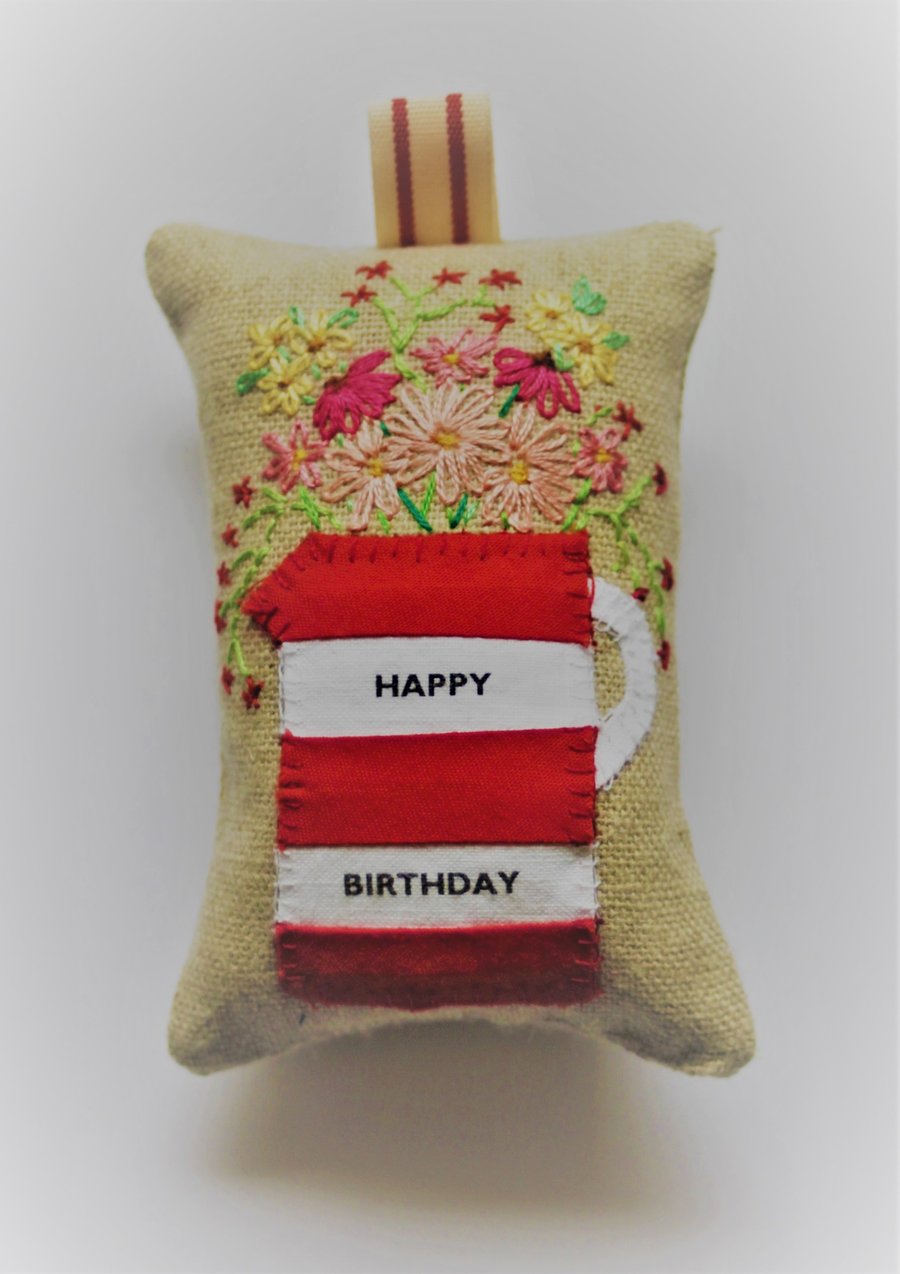Red and white personalised lavender bag with hand embroidered flowers