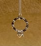 Circular silver necklace with tiny silver studs and 3 rings  - Image 1
