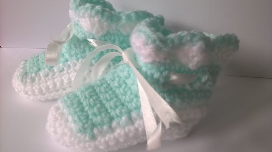 A Pair of Mint Green and White Crochet Baby Bootees
