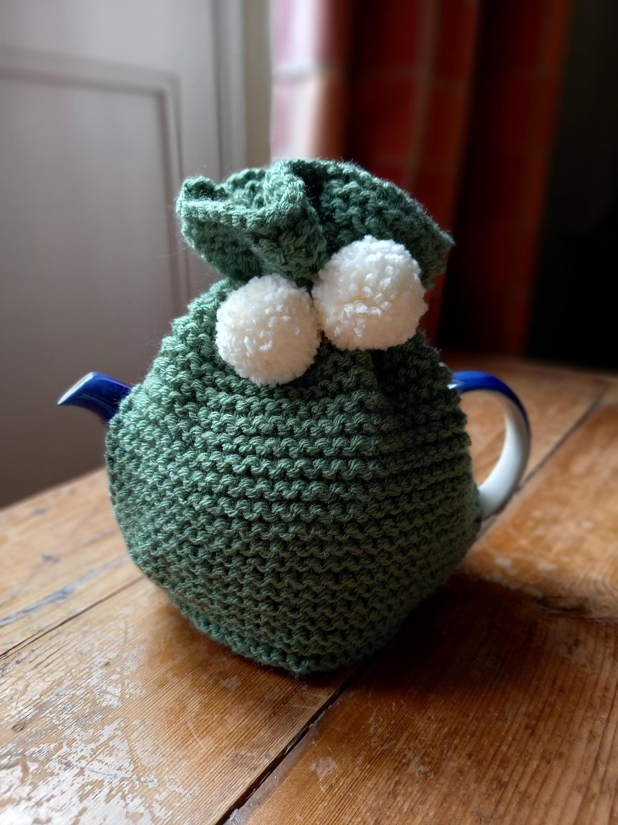 Hand knitted 2 pint (4 cup) tea cosy in Sage with cream pom poms