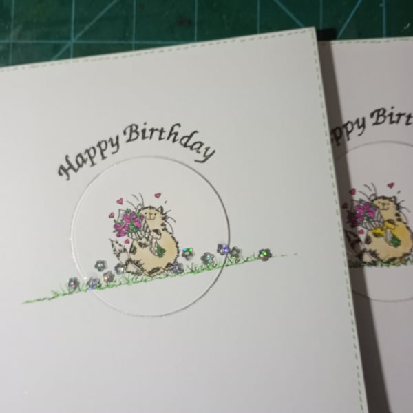 Cute cat with bouquet birthday card 