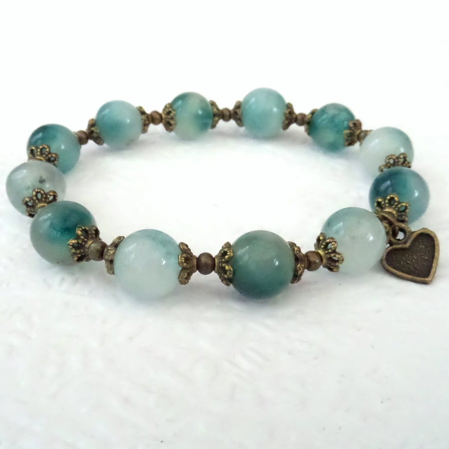 Handmade teal green jade and bronze bracelet with heart charm embellishment