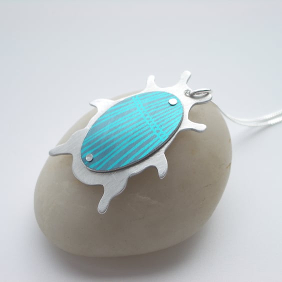 Beetle pendant necklace in teal and turquoise