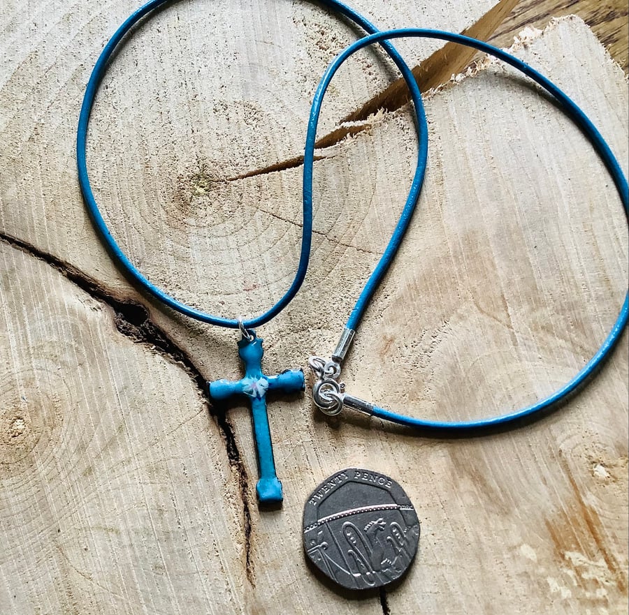 Blue enamelled copper cross pendant on blue leather cord