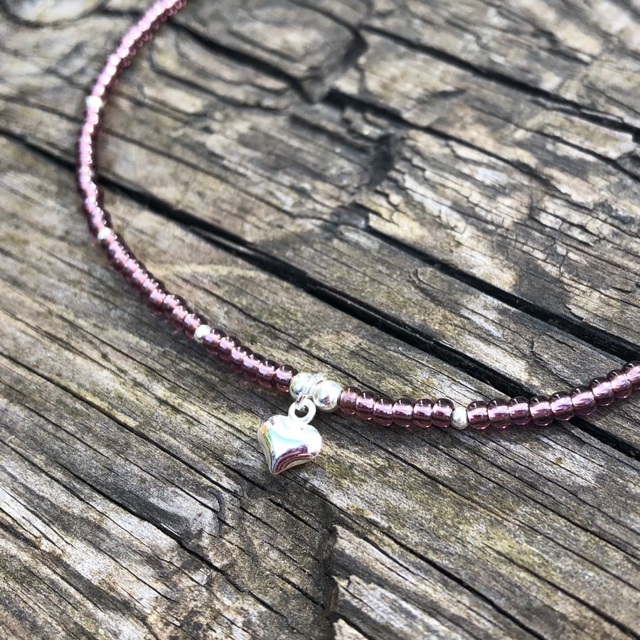 Purple seed bead with puffed heart charm anklet. Sterling silver anklet 