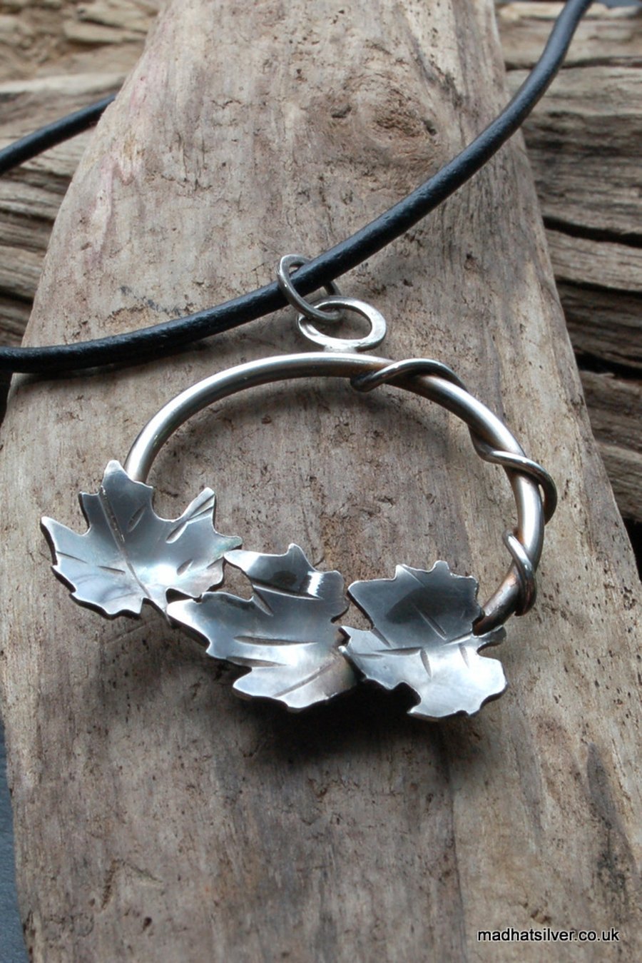 Circular silver leaf pendant