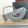 Ceramic bird decoration with patterned wing and tail 