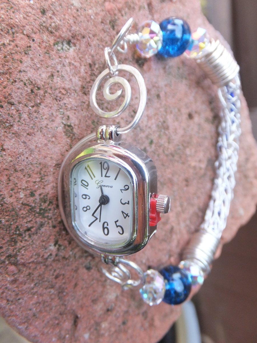 Watch with silver bracelet