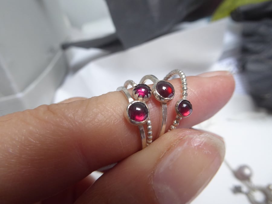 Rings stack with red garnet rings in sterling silver