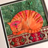Textile artwork of cat, fabric cat art, whimsical cat picture, tabby cat