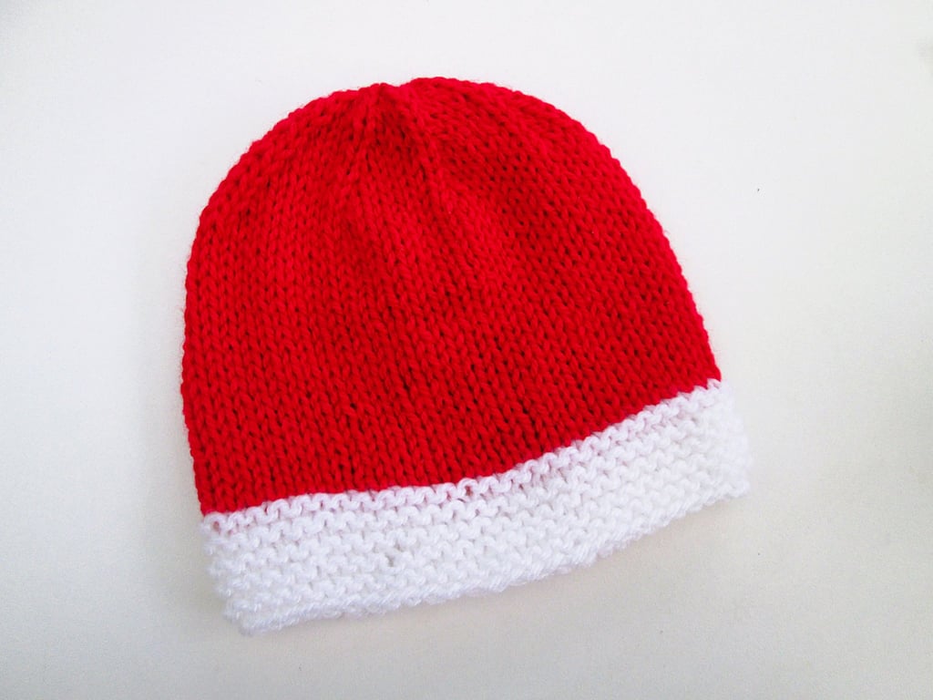 Hand knitted baby hat in red and white for Christmas