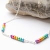 Rainbow beaded silver necklace.