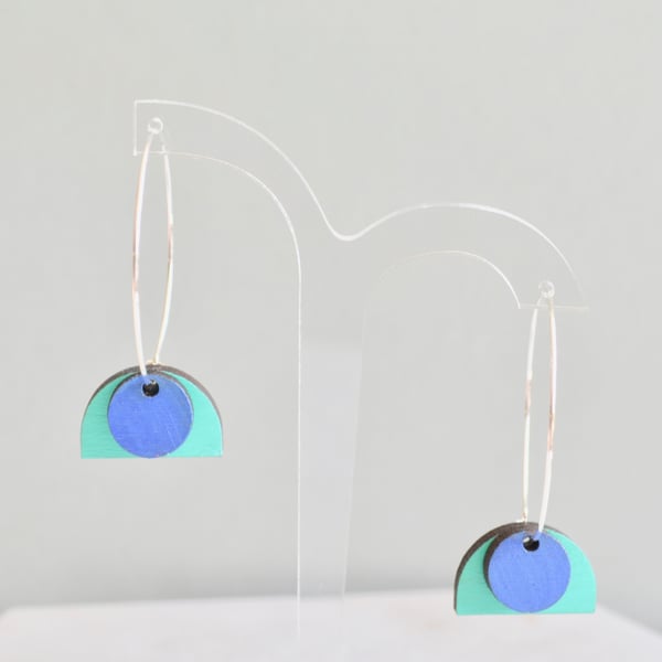 Silver hoop earrings with layered painted wooden shapes