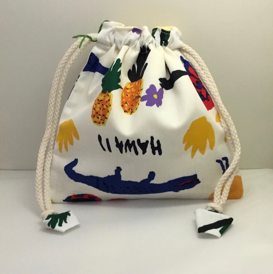 Toiletries bag with face mitt and eye pads.