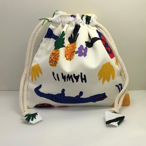 Toiletries bag with face mitt and eye pads.