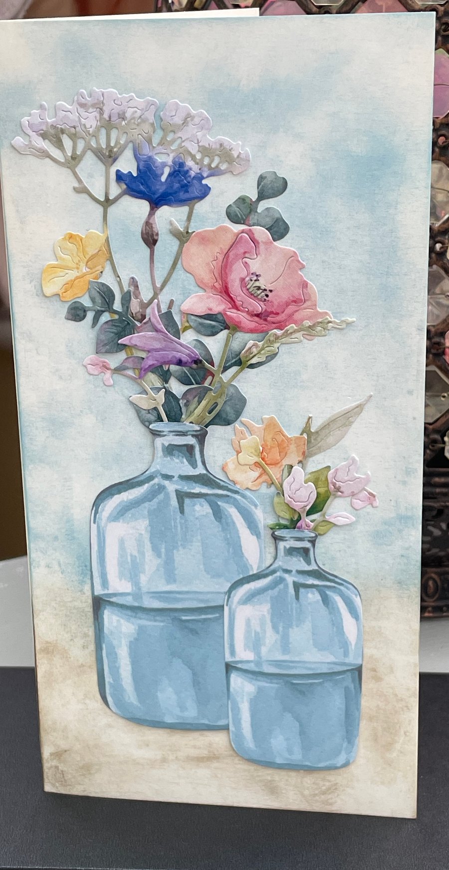 Delicate summer flowers in bottle vases card for any occasion