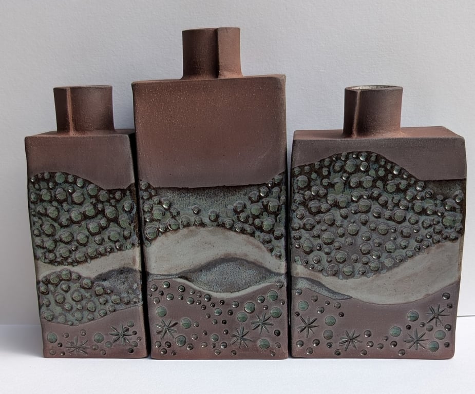 Trio of stoneware bud vases
