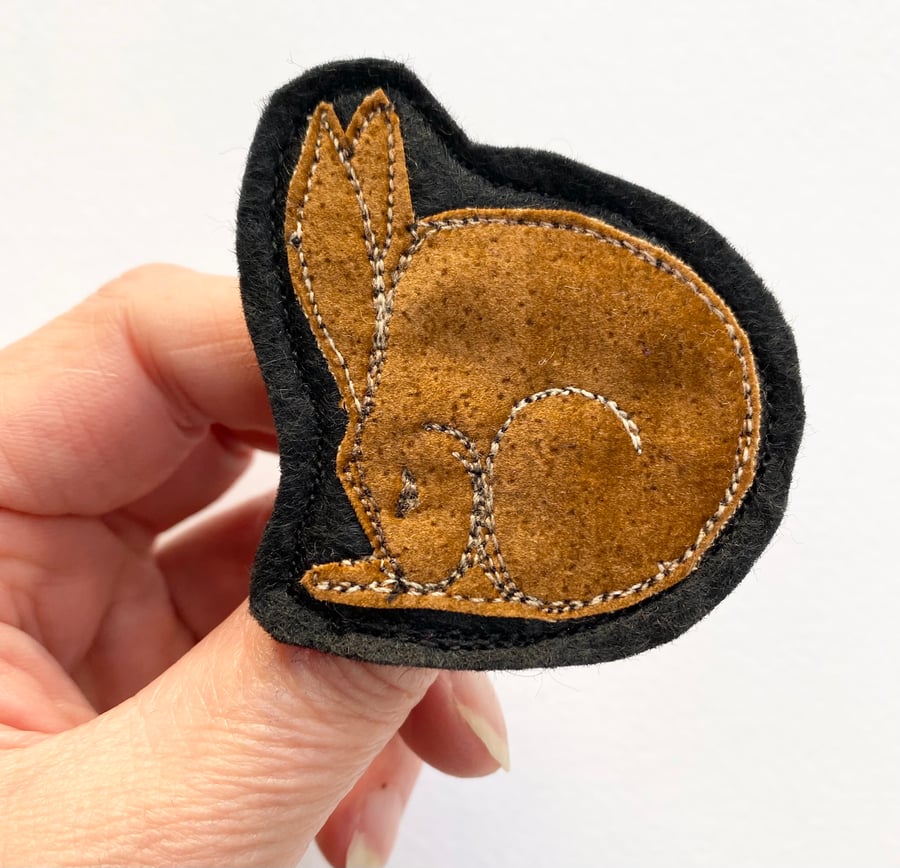 Upcycled sleeping hare brooch pin or badge. 