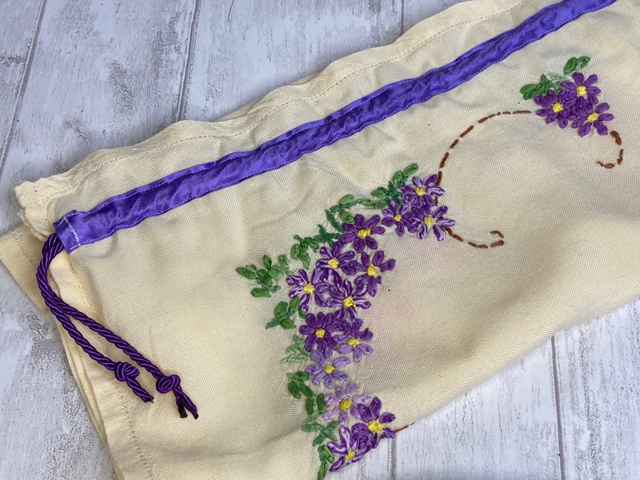 Travel packing laundry bag made from vintage embroidered cloth