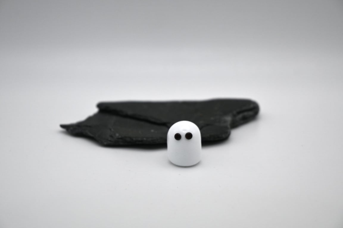 small glass ghost figure