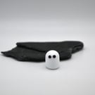 small glass ghost figure