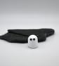 small glass ghost figure