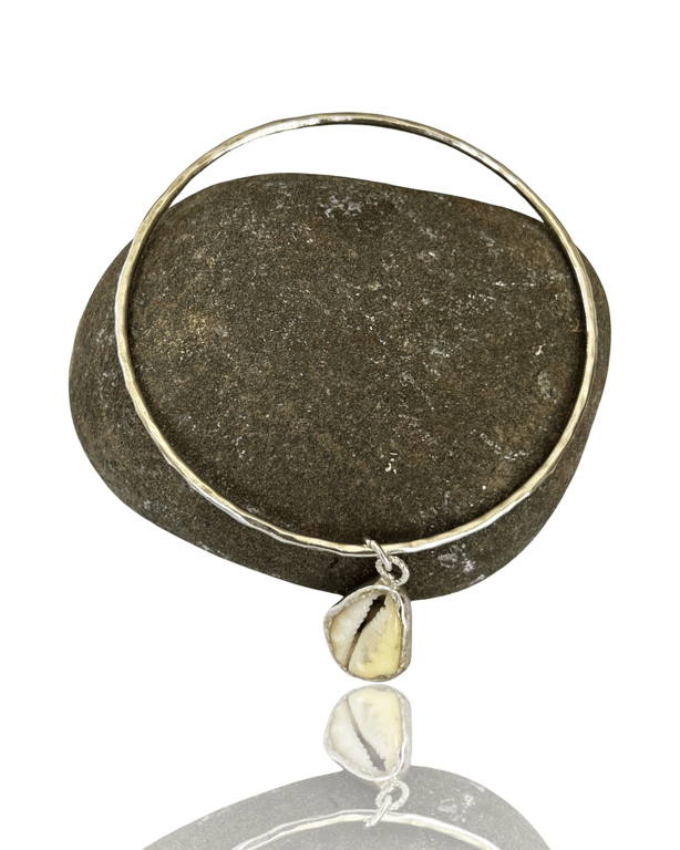 Sterling Silver Bangle With A Cowrie Shell Charm