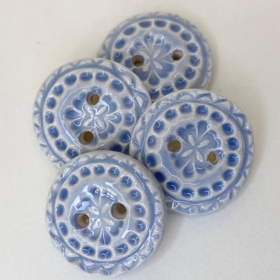 Set of four handmade ceramic buttons blue