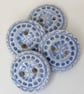 Set of four handmade ceramic buttons blue