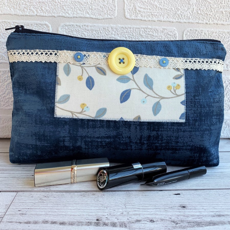 Large blue make up bag with leaf and berry print decorative panel
