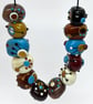 Handmade brown, ivory and turquoise patterned lamp work glass beads - Image 5